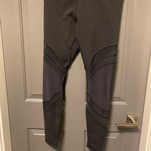 Size 10 lululemon leggings with mesh cutouts. Never worn in great condition.